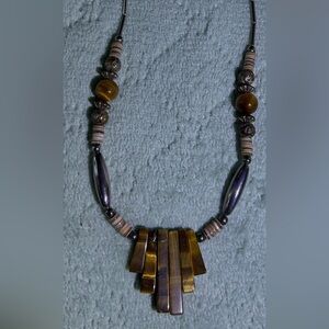 Elegant Brown and Gold Necklace with a twist magnetic closure. 16 1/2 “ long
